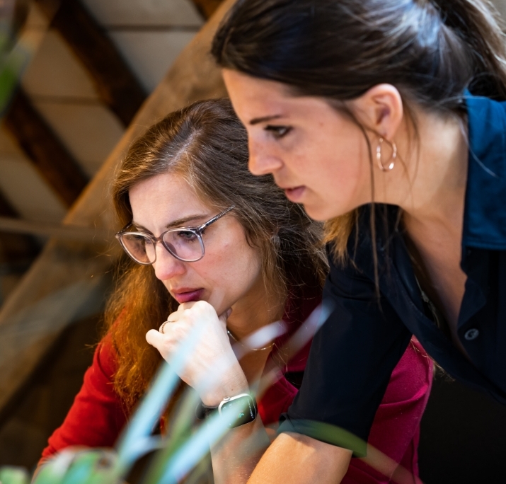 Two Women At A Desk